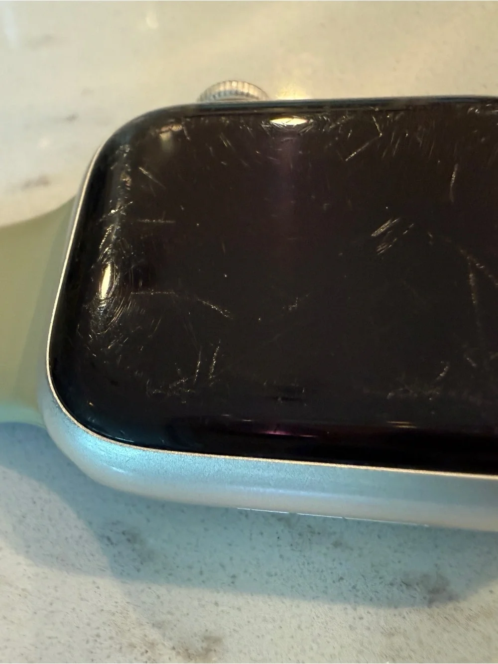 Apple Watch Series 7, 41mm with neutral Sport Band and Silver Aluminum Case